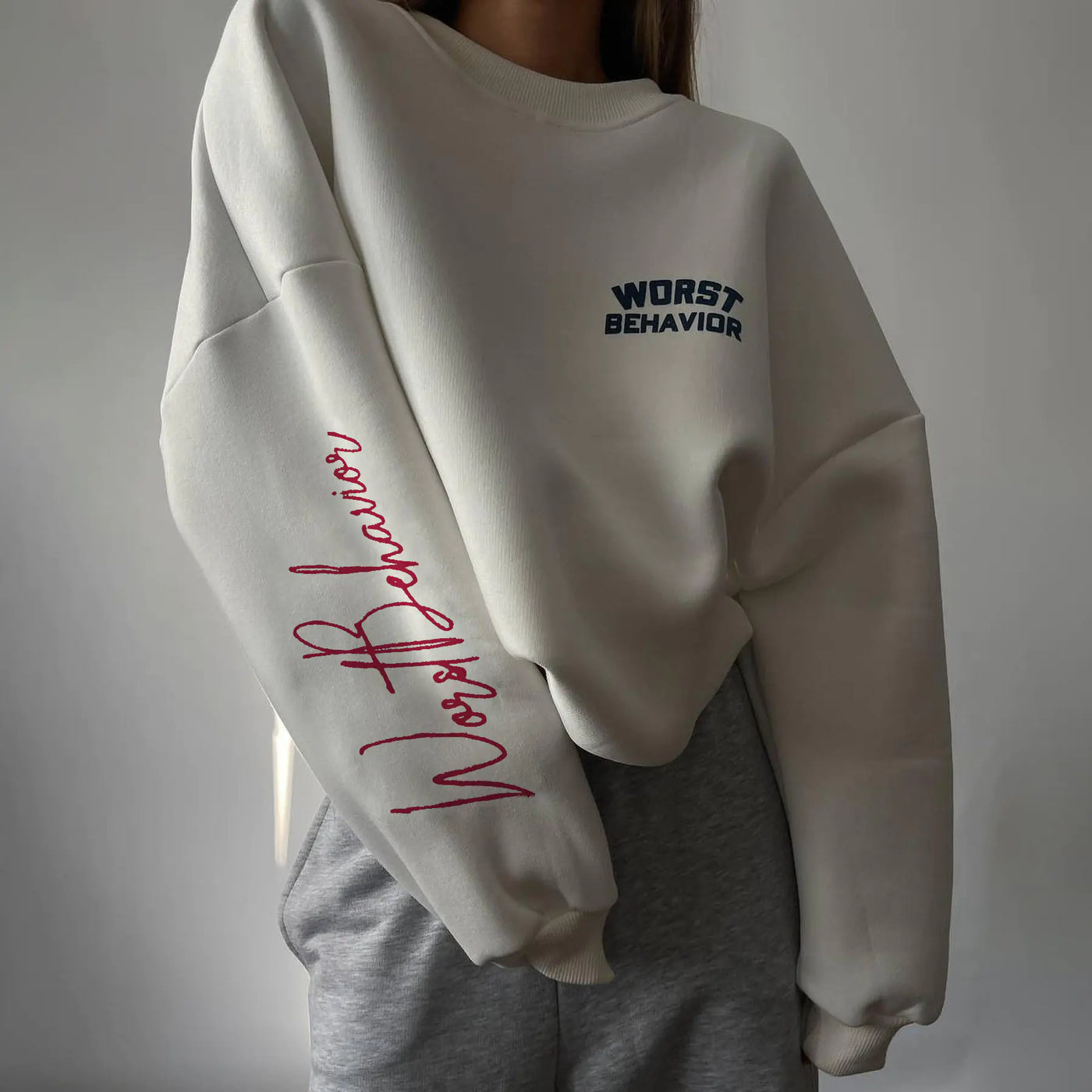 White sweatshirt with blue text on a plain background