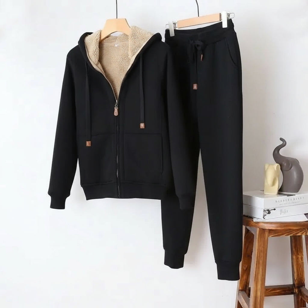 Black tracksuit with beige fleece lining on a white background