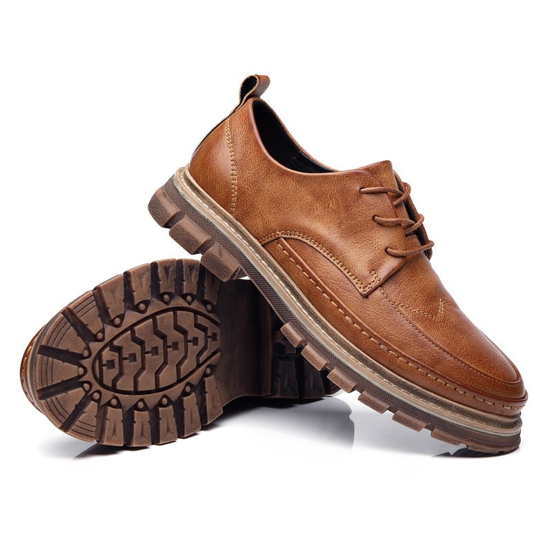 Brown leather shoes with a white background