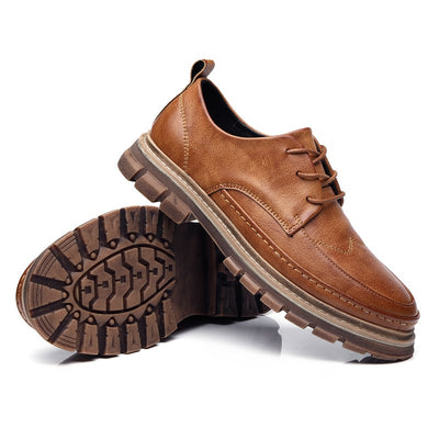 Brown leather shoes with a white background