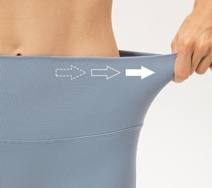 Person holding a gray garment with arrows indicating direction, on a light gray background