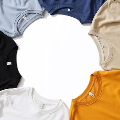 Collection of colorful t-shirts arranged in a circular pattern on a white background