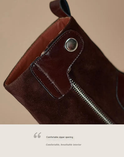 Brown leather bag with a zipper on a beige background