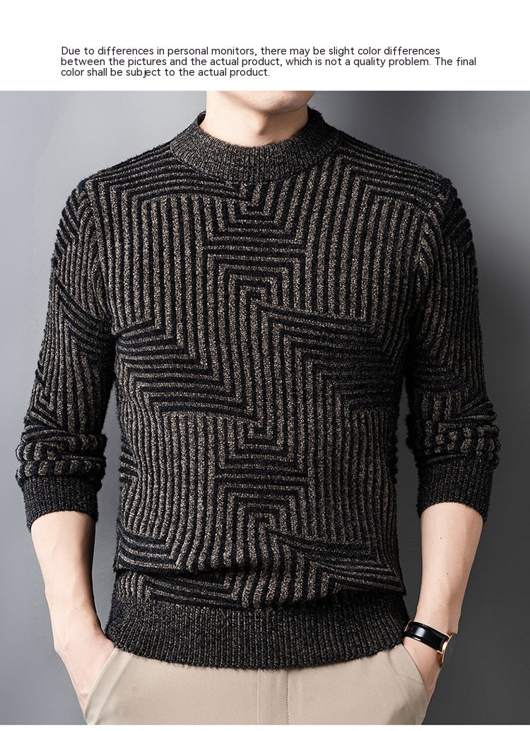 Black patterned sweater worn by a person on a gray background