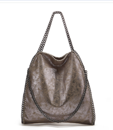 Metallic handbag with chain details on a white background