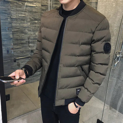 Person wearing a brown puffer jacket in an indoor setting