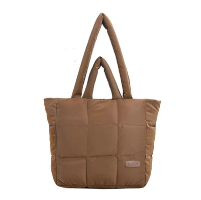 Brown quilted tote bag on a white background