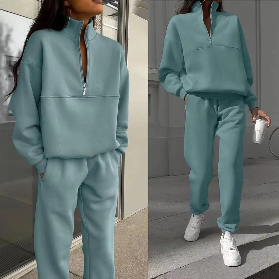 Teal tracksuit worn by a person, with a close-up of the top left and full-body view on the right.