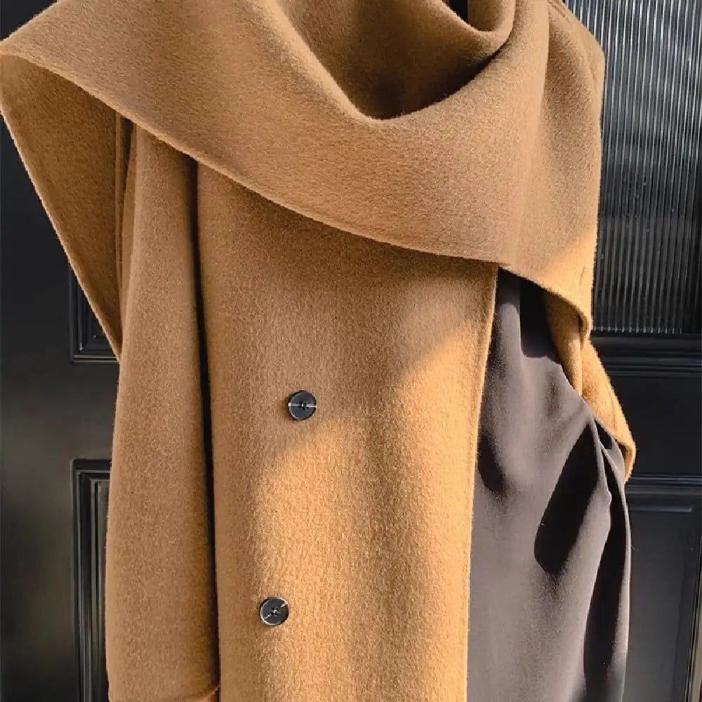 Close-up of a brown coat with a button on a dark background