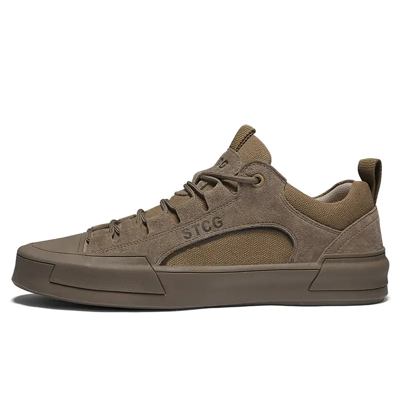 Brown sneaker with 'STCG' branding on a white background