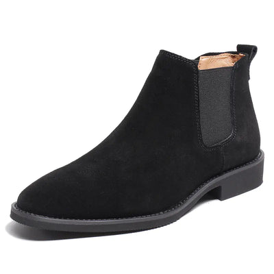 Black suede Chelsea boot on a white background