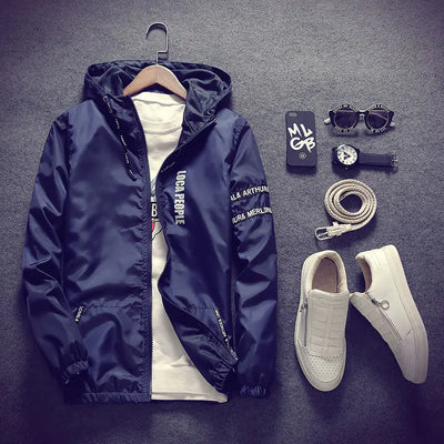 Navy jacket with white shirt, white sneakers, belt, sunglasses, and watch on a dark gray background