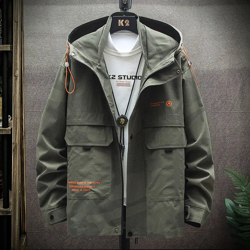 Green jacket with orange accents on a gray background