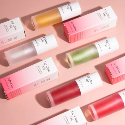 Lip balm products with visible brand names on a pink background