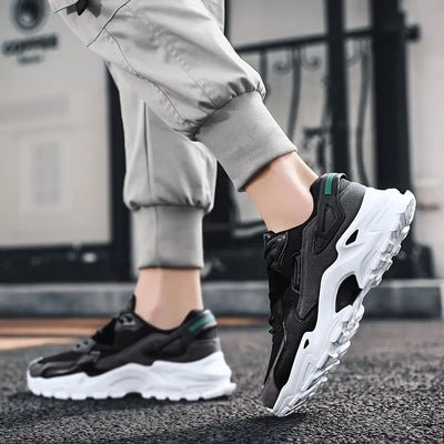 Person wearing black and white sneakers with a blurred background