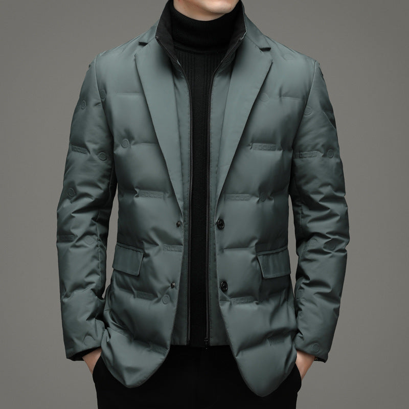 Green puffer jacket worn by a person on a gray background