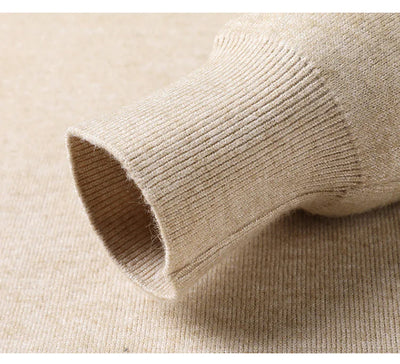 Close-up of beige knit fabric with a focus on texture and color.