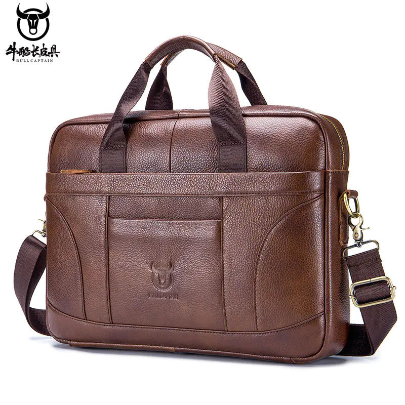 Brown leather briefcase with shoulder strap on a white background