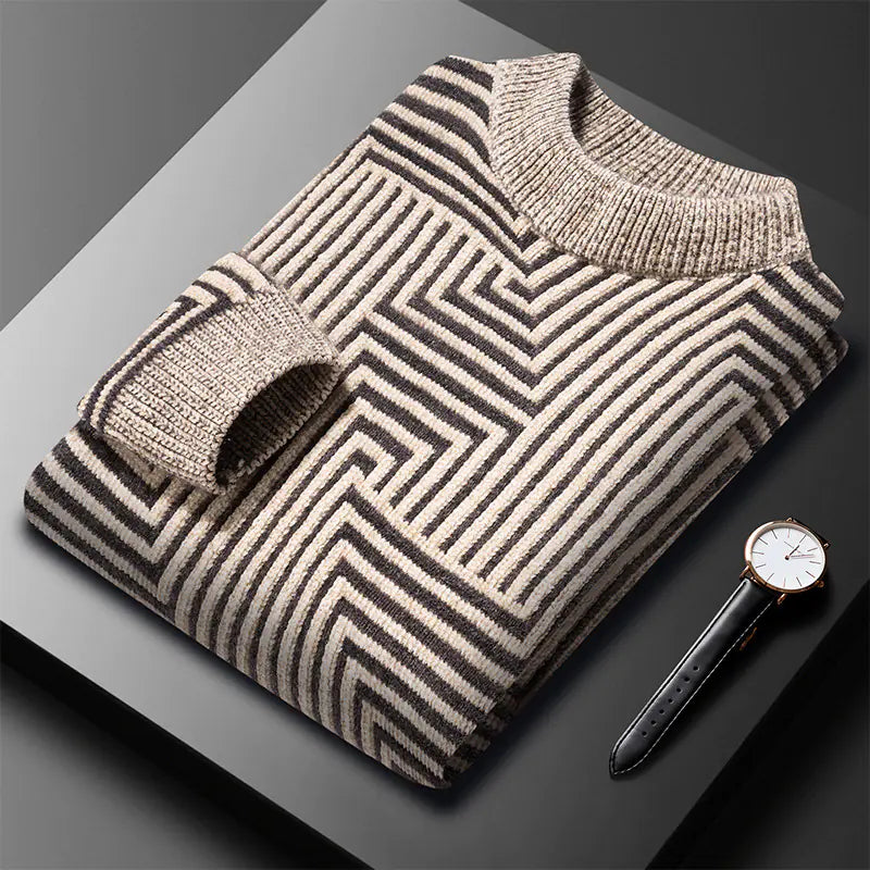 Folded striped sweater with a watch on a dark surface