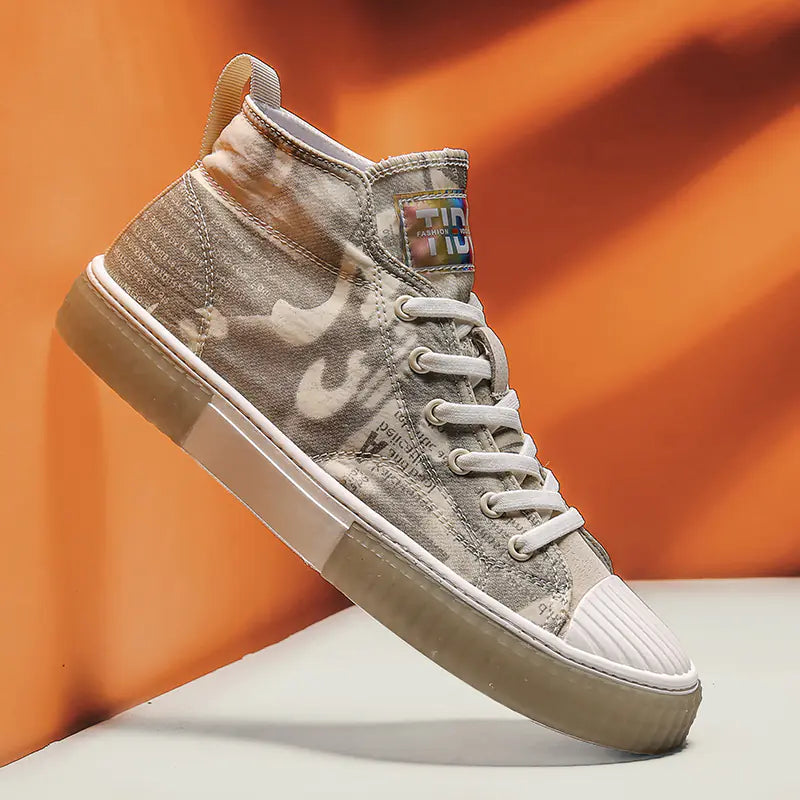 Beige sneaker with white sole on an orange background
