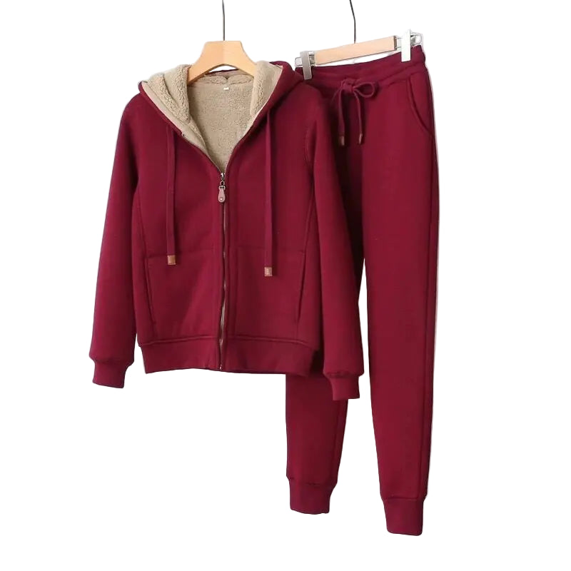 Maroon tracksuit with beige lining on a white background