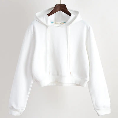 White hoodie on a hanger against a plain background