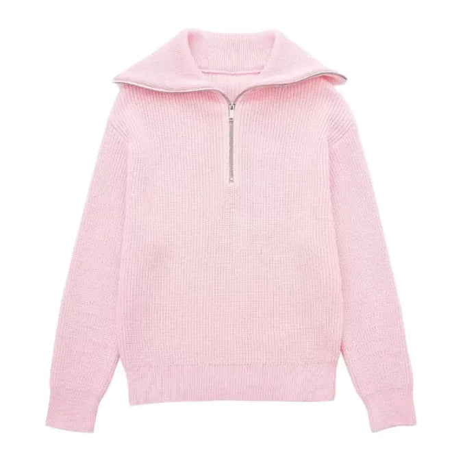 Pink ribbed sweater with a quarter zip on a white background