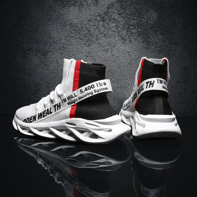 White and black sneakers with red accents on a reflective surface and dark background