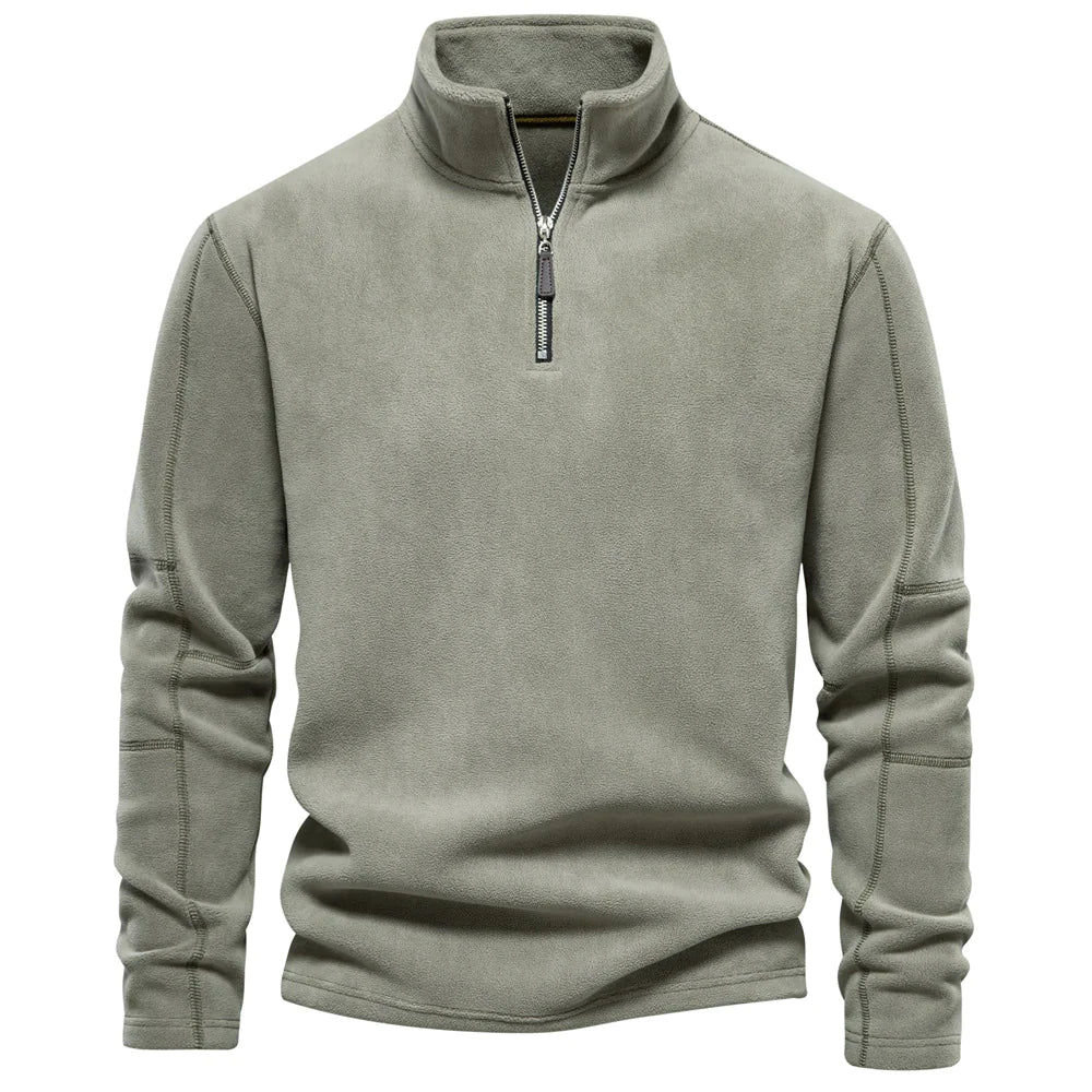 Green fleece pullover with a zipper on a white background