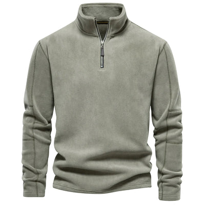 Green fleece pullover with a zipper on a white background
