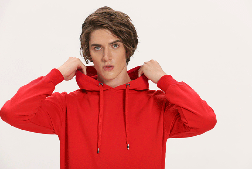 Person wearing a red hoodie on a plain background
