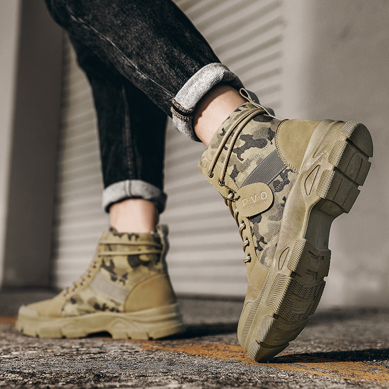 Camouflage boots being worn on a concrete surface with a blurred background