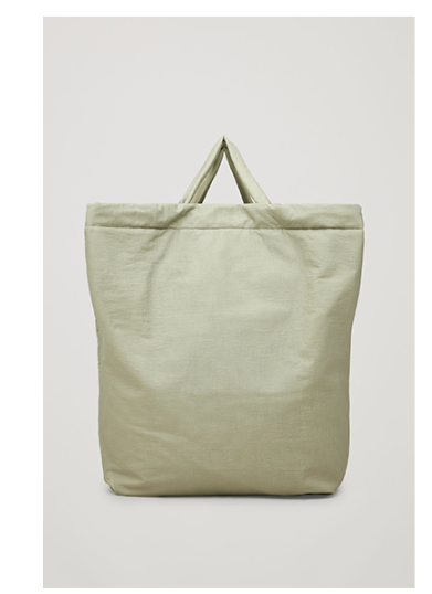 Green tote bag on a light gray background