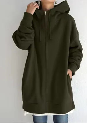 Person wearing a long dark green hoodie against a white background