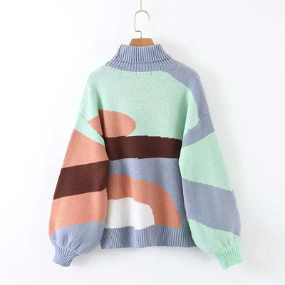 Colorful sweater with geometric pattern on a white background