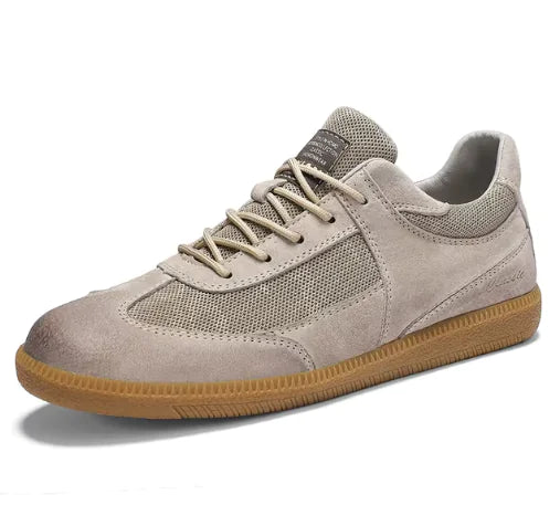Beige sneaker with brown sole on a white background