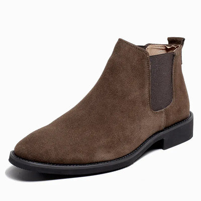 Brown suede Chelsea boot on a white background