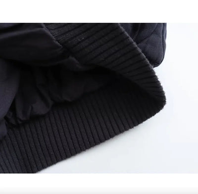 Close-up of a dark blue knitted sweater on a white background
