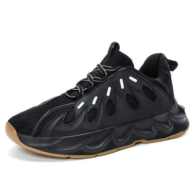 Black sneaker with a unique sole design on a white background