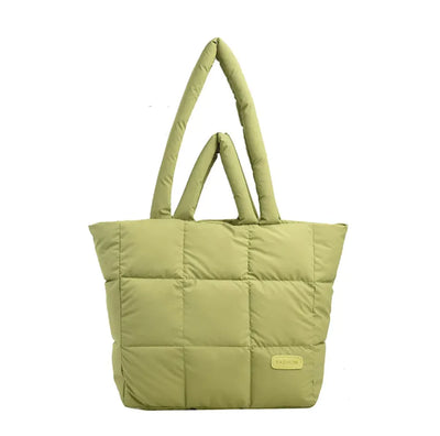 Green quilted tote bag on a white background