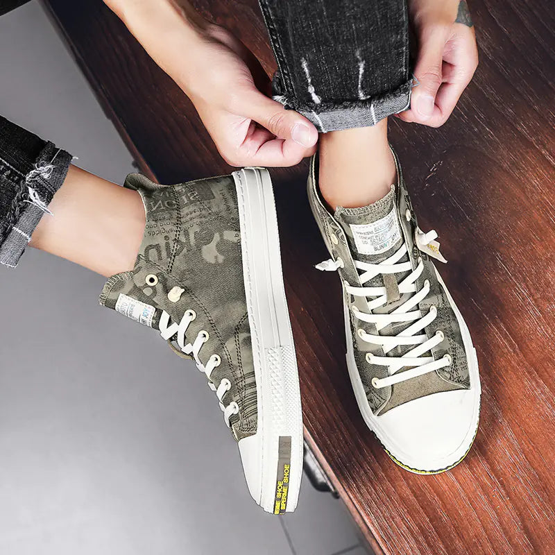 Person wearing green high-top sneakers with white soles on a wooden floor.