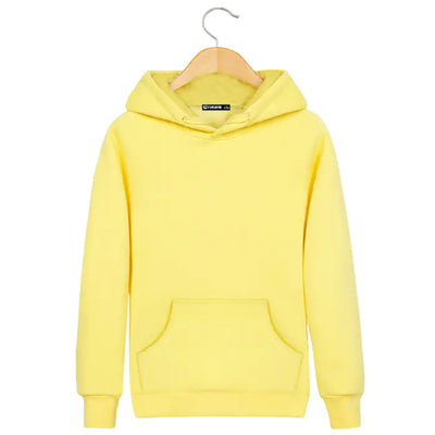 Yellow hoodie on a hanger against a white background