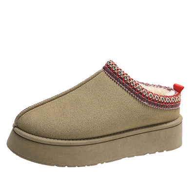 Beige slipper with red and white trim on a white background