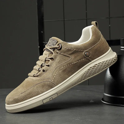 Brown suede sneaker on a dark background
