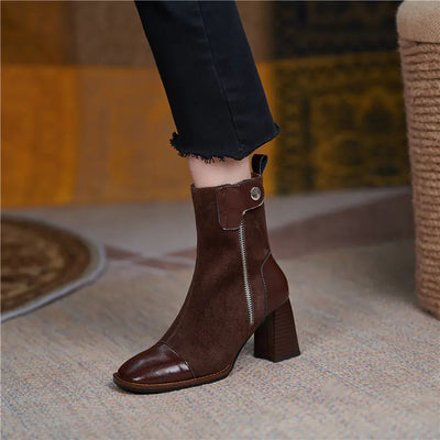Brown ankle boot with a block heel worn by a person on a blurred indoor background