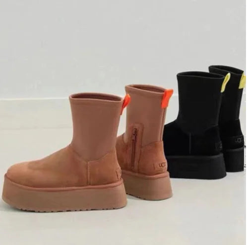 Tan platform boots with a white background